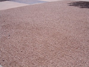Lawn Care raking sand in Arizona